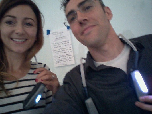 photo of 2 people wearing around-the-neck Alia devices